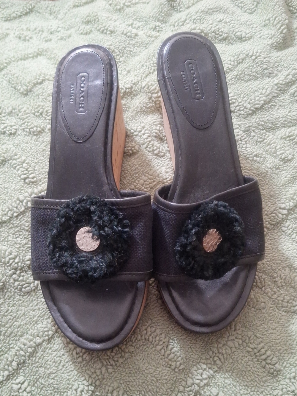 COACH Black Slide Mules with Textured Rosette and Metallic Accent